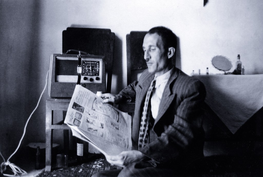 My wife's father reading a newspaper 1955.